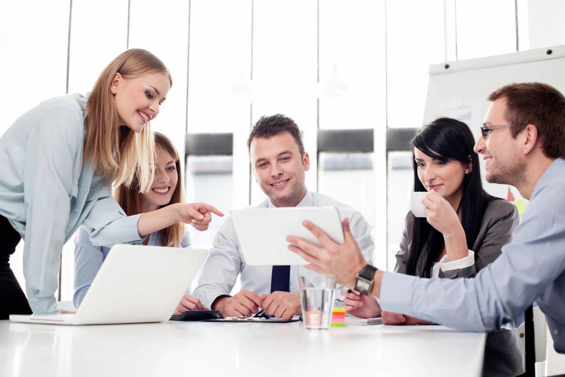 A group of people sitting around a table.